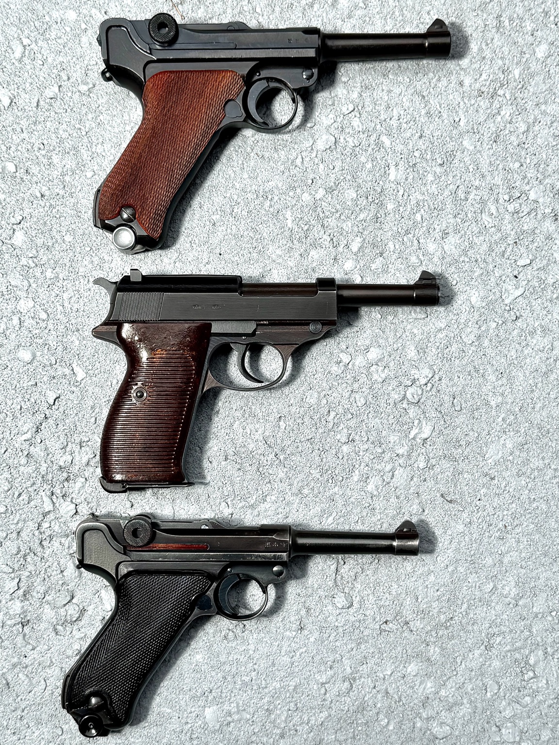 Reverse-side view of a Mauser Luger, P38 and Mauser Luger
